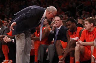 Gerry McNamara watches as Jim Boeheim yells at Rakeem Christmas. The senior center played only 17 minutes in the loss, scoring 4 points and snagging six rebounds.