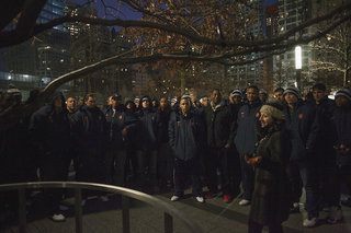 The Syracuse football team stands in front of a tree that survived the Sept. 11 attacks on the World Trade Center. The tree was replanted as part of the 9/11 Memorial.