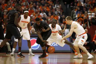 Syracuse center Baye Moussa Keita fights for a loose ball.