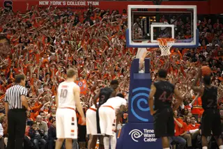 The Syracuse student section attempts to distract Cincinnati shooting guard Sean Kilpatrick during a free throw.  