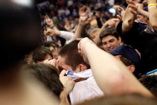 Villanova guard Ryan Arcidiacono (15) is surrounded by fans that stormed the court.
