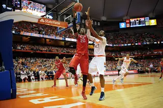 Syracuse forward James Southerland fights for the ball with Rutgers forward Kadeem Jack.