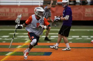 Syracuse midfielder Drew Jenkins rushes into the offensive zone.