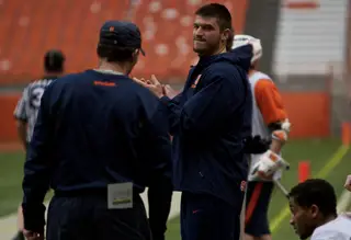 Syracuse defender Brian Megill cheers on the sideline. Megill didn't suit up for the second of two SU scrimmages.