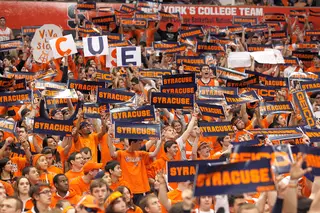 The Syracuse University student section holds up signs, posters and banners in cheering the Orange on to a 63-47 win against Notre Dame Monday night.