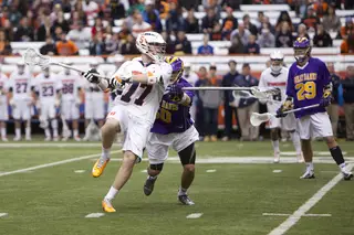 Henry Schoonmaker takes a jumping shot from the perimeter against Albany in the Carrier Dome Sunday. The sophomore midfielder scored unassisted from 15 yards out with eight seconds left in the first quarter.