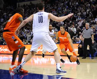 Syracuse point guard Michael Carter-Williams drives into the paint from the wing.