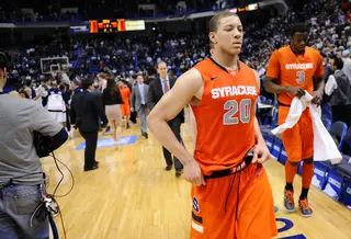 Syracuse shooting guard Brandon Triche walks off the court for one last time against Connecticut.