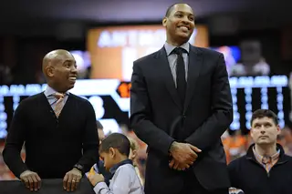 Carmelo Anthony stands beside Daryl Gross ahead of his jersey retirement ceremony at halftime Saturday night.