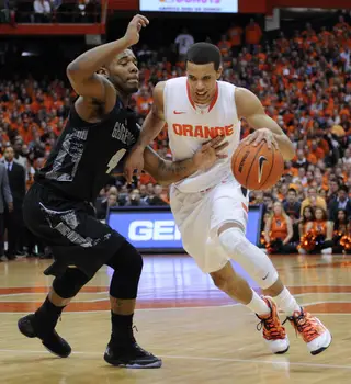 Michale Carter-Williams drives to his left in Saturday's 57-46 loss to Georgetown in the Carrier Dome.