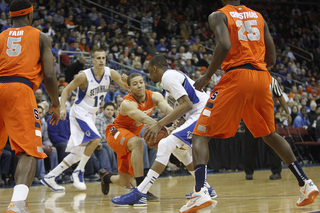 Brandon Triche flocks to the ball in the Orange's Big East win at the Prudential Center in Newark, N.J.