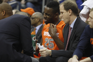 Rakeem Christmas takes some coaching from Jim Boeheim and Mike Hopkins in the Orange's 76-65 victory at Seton Hall Saturday night. Christmas was limited to 16 minutes as Baye Moussa Keita played the majority of SU's big man time.