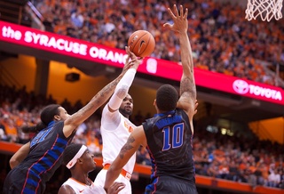 Forward James Southerland attempts a shot in traffic. He scored 22 points on his Senior Night.