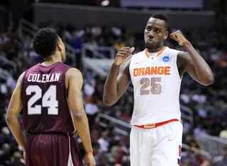 Rakeem Christmas of the Syracuse Orange reacts after a play in front of Spencer Coleman of the Montana Grizzlies.