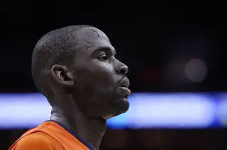 Baye Moussa-Keita #12 of the Syracuse Orange is seen walking off the court with blood on his head after an injury in the game.
