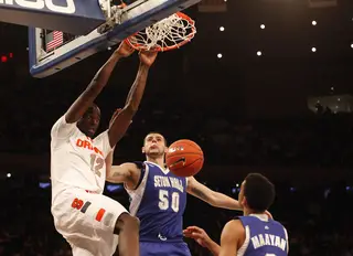 Baye Moussa Keita dunks over Aaron Geramipoor. Keita scored 8 points and grabbed four rebounds in 20 minutes Wednesday night at Madison Square Garden.