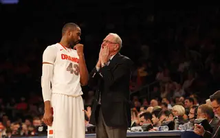 Head coach Jim Boeheim talks with James Southerland on the sidelines during the Syracuse vs. Seton Hall game.