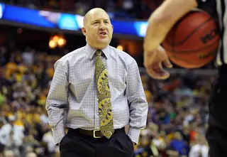 Head coach Buzz Williams of the Marquette Golden Eagles speaks with an official during the game against the Syracuse Orange.