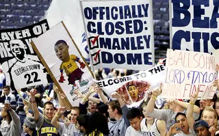 Fans of the Georgetown Hoyas cheer and hold up posters of Otto Porter Jr. (not pictured) and a sign with the phrase 'Officially Closed: Manley, Dome' prior to the game against the Syracuse Orange at the Verizon Center on March 9, 2013 in Washington, D.C.