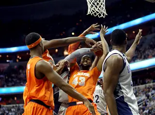 James Southerland is swarmed by a group of Georgetown defenders in the paint.