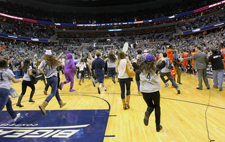 Fans storm the court following Georgetown's win in the Big East regular-season finale.