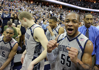 Jabril Trawick pumps his fists in celebration as he comes off the court following Georgetown's 61-39 win over Syracuse.