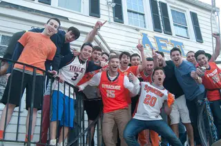 Alpha Epsilon Pi members pose during celebration party for SU's win against Marquette.