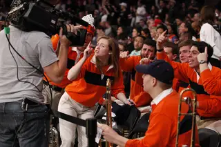Philomena Duffy, director of Sour Sitrus Society, cheers with the band in Madison Square Garden as Syracuse took on Seton Hall in the second round of the Big East tournament.
