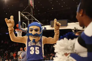 Seton Hall's mascot, The Pirate, excites the crowd before SU and Seton Hall tipped off.