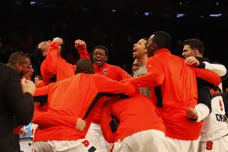 Syracuse huddles as a team to get pumped up before its Big East tournament opener against Seton Hall.