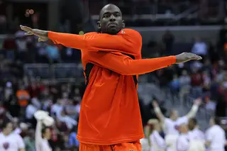 Baye Moussa-Keita #12 of the Syracuse Orange warms up on the court prior to the game against the Indiana Hoosiers.