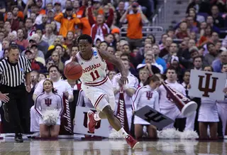 Kevin (Yogi) Ferrell #11 of the Indiana Hoosiers drives the ball down the court against the Syracuse Orange.