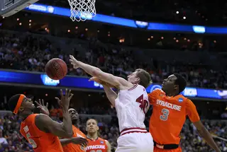 Cody Zeller #40 of the Indiana Hoosiers puts the ball up to the basket against C.J. Fair #5 and Jerami Grant #3.