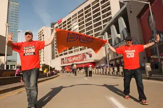 Brad Champaign (left) and John Michaels (right) march toward the Georgia Dome, cheering on the orange. 