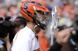 A Syracuse player walks off the field in defeat after the game. 