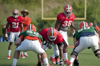 Junior linebacker Cam Lynch looks on before a snap during Syracuse training camp.
