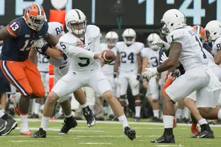 Tyler Ferguson threw one pass for Penn State when Hackenberg was briefly sidelined. Here, Ferguson hands the ball off to Belton. 
