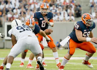 Syracuse quarterback Drew Allen takes a snap from center Macky MacPherson. Allen finished 17-for-38 with 193 yards and two interceptions in his debut. 