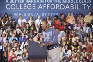President Barack Obama addresses the issue of college affordability while on stage inside Henninger High School.