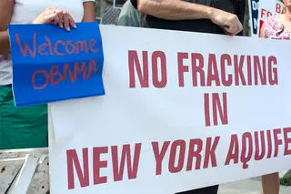 Citizens welcome President Barack Obama while protesting against hydrofracking in New York.