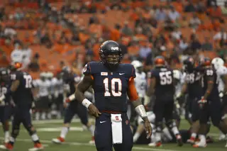 Terrel Hunt stands to the side of the offense. The Syracuse quarterback made his first career start against Tulane.