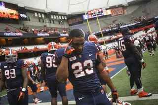 Syracuse running back Prince-Tyson Gulley touches his head before the game. Gulley was the Orange's leading rusher against Tulane.