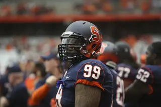 Syracuse defensive tackle Ryan Sloan watches from the sideline.