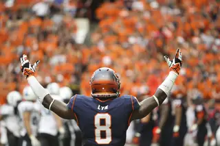 Syracuse cornerback Keon Lyn raises his hands to pump up the Carrier Dome crowd.