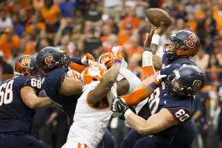 SU quarterback Terrel Hunt attempts a pass in the midst of a blitz from the Tigers defense. 