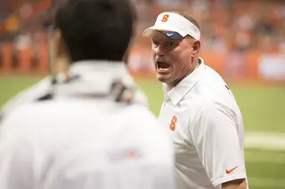 Syracuse head coach Scott Shaffer yells at a referee for not calling a penalty on a kick return.