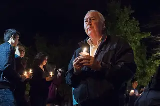 Oct. 8, 2013: Graham Herbert, the principal of Lockerbie Academy in Scotland, pays his respects to the 35 SU students who died in the Pan Am Flight 103 bombing at a candlelight vigil. The 25th anniversary of the tragedy is recognized through Remembrance Week 2013.