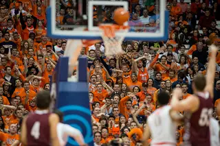 Colgate's Ethan Jacobs watches his shot come off the rim in front of a rowdy SU crowd. 