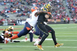 Brandon Reddish drags down a Maryland player for one of his three solo tackles. 
