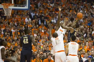 C.J. Fair and Baye Moussa Keita contest a Lamar Patterson floater in the first half of No. 2 Syracuse's game against No. 22 Pittsburgh on Saturday. 